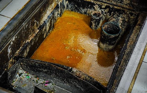 neglecting grease trap cleaning can cause clogs, foul odors, and even sewage backups